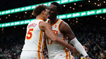 Hawks guard Dyson Daniels (5) and center Onyeka Okongwu (17) react after defeating the Boston Celtics at TD Garden. 