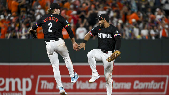 Baltimore Orioles shortstop Gunnar Henderson (2)] and  outfielder Anthony Santander.