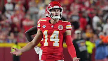 Sep 5, 2024; Kansas City, Missouri, USA; Kansas City Chiefs punter Matt Araiza (14) reacts while watching a replay against the Baltimore Ravens during the game at GEHA Field at Arrowhead Stadium. Mandatory Credit: Denny Medley-Imagn Images