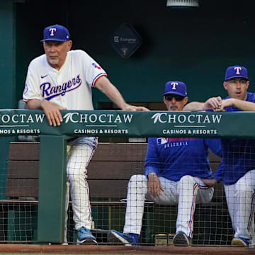 Arlington, Texas, USA; Texas Rangers manager Bruce Bochy (15) looks on from the dugout during the second inning of a game against the Colorado Rockies at Globe Life Field.