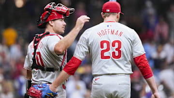 Philadelphia Phillies catcher J.T. Realmuto (10) greets pitcher Jeff Hoffman (23) following the game against the Milwaukee Brewers at American Family Field.