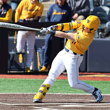 West Virginia University infielder Sam White lifts a three-run home run in the bottom of the first inning against Kennesaw State.