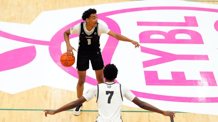 July 19, 2025; North Augusta, South Carolina, USA; Brad Beal Elite Quentin Coleman (1) gestures to a teammate as Team Durant Evans Barning Jr. (7) defends during the Brad Beal Elite and Team Durant game at the Nike EYBL Peach Jam at Riverview Park Activity Center. Brad Beal Elite won 91-59. Mandatory Credit: Katie Goodale - Augusta Chronicle/USA TODAY NETWORK