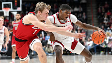 Nov 21, 2024; Spokane, Washington, USA; Washington State Cougars guard Cedric Coward (0) controls the ball against Eastern Washington Eagles guard Andrew Cook (9) in the first half at Spokane Veterans Memorial Arena. Mandatory Credit: James Snook-Imagn Images