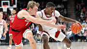 Washington State guard Cedric Coward hangs onto the ball under pressure from Eastern Washington's Andrew Cook.