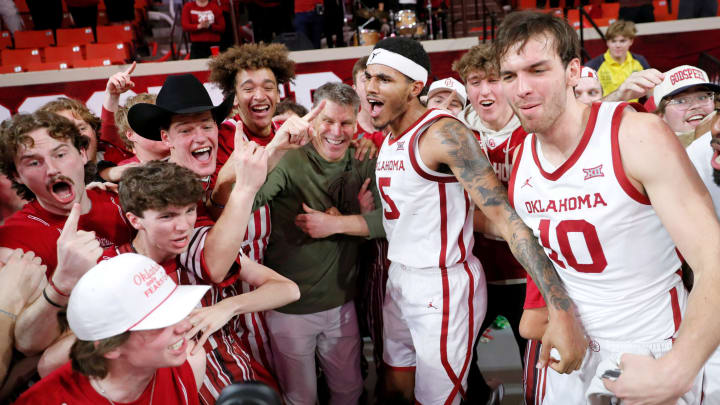 Oklahoma coach Porter Moser and his Sooner team celebrate a home Bedlam victory over in-state rival Oklahoma State.