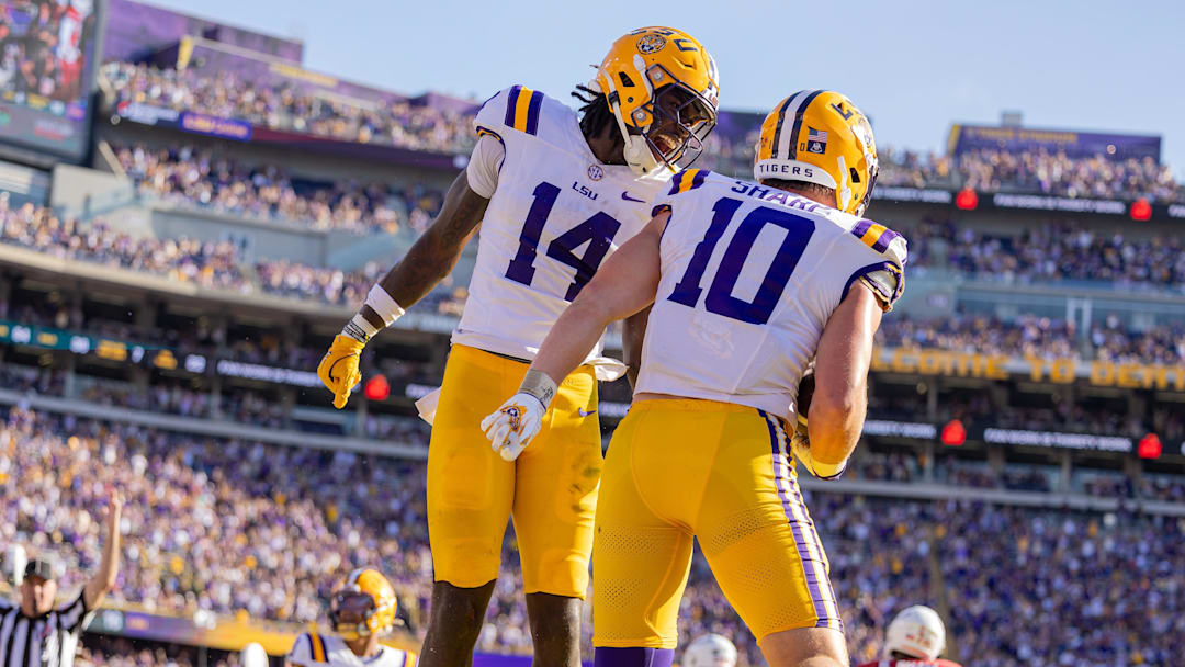  LSU Tigers tight end Trey'Dez Green (14) celebrates a touchdown by tight end Bauer Sharp (10) against the Arkansas Razorbacks during the second half at Tiger Stadium.