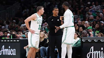 Oct 15, 2025; Boston, Massachusetts, USA; Boston Celtics head coach Joe Mazzulla talks with Boston Celtics guard Payton Pritchard (11) and Boston Celtics forward Jaylen Brown (7) during the first half against the Toronto Raptors at TD Garden. Mandatory Credit: Paul Rutherford-Imagn Images