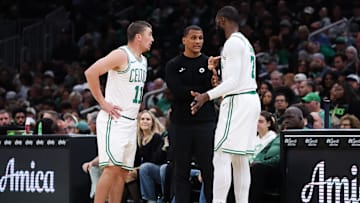 Oct 15, 2025; Boston, Massachusetts, USA; Boston Celtics head coach Joe Mazzulla talks with Boston Celtics guard Payton Pritchard (11) and Boston Celtics forward Jaylen Brown (7) during the first half against the Toronto Raptors at TD Garden. Mandatory Credit: Paul Rutherford-Imagn Images