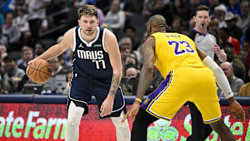 Dec 12, 2023; Dallas, Texas, USA; Dallas Mavericks guard Luka Doncic (77) and Los Angeles Lakers forward LeBron James (23) in action during the game between the Dallas Mavericks and the Los Angeles Lakers at the American Airlines Center. Mandatory Credit: Jerome Miron-Imagn Images