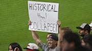 Sep 24, 2025; Cleveland, Ohio, USA; A fan holds a sign during a game between the Cleveland Guardians and the Detroit Tigers at Progressive Field. Mandatory Credit: David Richard-Imagn Images