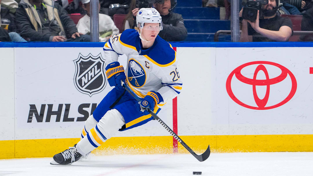 Jan 21, 2025; Vancouver, British Columbia, CAN; Buffalo Sabres defenseman Rasmus Dahlin (26) handles the puck against the Vancouver Canucks in the second period at Rogers Arena. Mandatory Credit: Bob Frid-Imagn Images