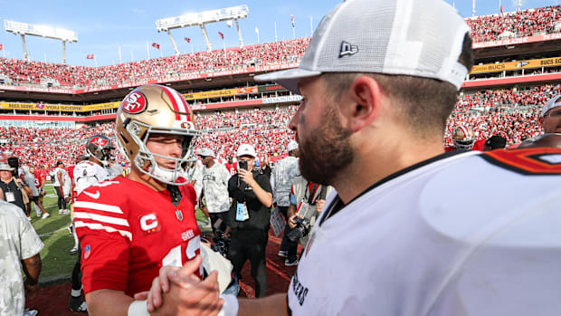 San Francisco 49ers quarterback Brock Purdy greets Tampa Bay Buccaneers quarterback Baker Mayfield.