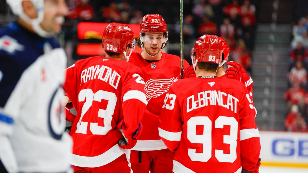 Detroit Red Wings defenseman Moritz Seider (53) talks with teammates Lucas Raymond (23) and Alex DeBrincat (93) Mandatory Credit: Brian Bradshaw Sevald-Imagn Images Detroit Red Wings defenseman Moritz Seider (53) talks with teammates Lucas Raymond (23) and Alex DeBrincat (93) Mandatory Credit: Brian Bradshaw Sevald-Imagn Images