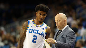 Nov 3, 2025; Los Angeles, California, USA;  UCLA Bruins head coach Mick Cronin talks to guard Donovan Dent (2) during the second half against the Eastern Washington Eagles at Pauley Pavilion presented by Wescom Financial. Mandatory Credit: Kiyoshi Mio-Imagn Images