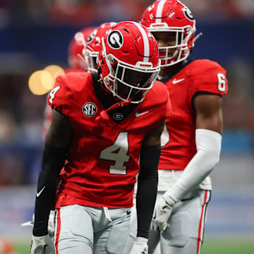 Aug 31, 2024; Atlanta, Georgia, USA; Georgia Bulldogs defensive back KJ Bolden (4) reacts after a tackle against the Clemson Tigers in the first quarter at Mercedes-Benz Stadium. Mandatory Credit: Brett Davis-Imagn Images