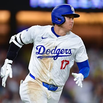 Sep 9, 2024; Los Angeles, California, USA; Los Angeles Dodgers designated hitter Shohei Ohtani (17) runs after hitting a single against the Chicago Cubs during the seventh inning at Dodger Stadium.