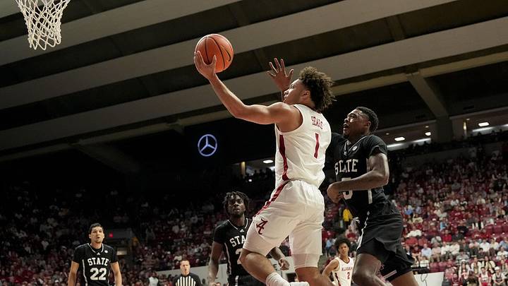 Feb 25, 2025; Tuscaloosa, AL, USA;  Alabama guard Mark Sears (1) slips past Mississippi State guard Shawn Jones Jr. (5) as he goes to the basket at Coleman Coliseum. Mandatory Credit: Gary Cosby Jr.-Tuscaloosa News