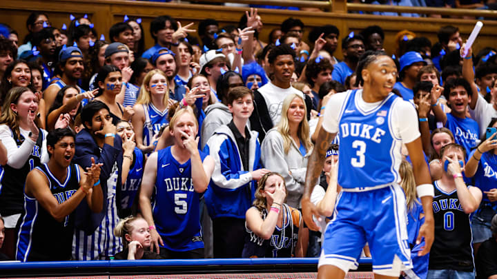 Oct 3, 2025; Durham, NC, USA; Duke Blue Devils guard Isaiah Evans (3) shoots a three-pointer, celebrated by the Cameron Crazies.