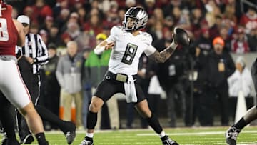 Nov 16, 2024; Madison, Wisconsin, USA;  Oregon Ducks quarterback Dillon Gabriel (8) throws a pass during the first quarter against the Wisconsin Badgers at Camp Randall Stadium. Mandatory Credit: Jeff Hanisch-Imagn Images
