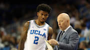 Nov 3, 2025; Los Angeles, California, USA;  UCLA Bruins head coach Mick Cronin talks to guard Donovan Dent (2) during the second half against the Eastern Washington Eagles at Pauley Pavilion presented by Wescom Financial. Mandatory Credit: Kiyoshi Mio-Imagn Images