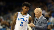 Nov 3, 2025; Los Angeles, California, USA;  UCLA Bruins head coach Mick Cronin talks to guard Donovan Dent (2) during the second half against the Eastern Washington Eagles at Pauley Pavilion presented by Wescom Financial. Mandatory Credit: Kiyoshi Mio-Imagn Images