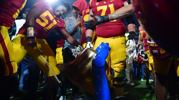 Southern California Trojans celebrate with the victory bell at the Rose Bowl.