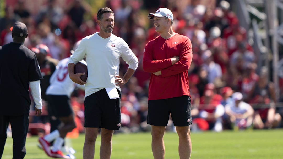 Jul 27, 2022; Santa Clara, CA, USA; San Francisco 49ers head coach Kyle Shanahan (left) and general manager John Lynch watches the players during Training Camp at the SAP Performance Facility near Levi Stadium. Mandatory Credit: Stan Szeto-Imagn Images