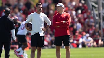 Jul 27, 2022; Santa Clara, CA, USA; San Francisco 49ers head coach Kyle Shanahan (left) and general manager John Lynch watches the players during Training Camp at the SAP Performance Facility near Levi Stadium. Mandatory Credit: Stan Szeto-Imagn Images