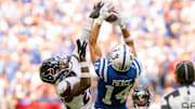 Sep 8, 2024; Indianapolis, Indiana, USA; Indianapolis Colts wide receiver Alec Pierce (14) catches a long pass under coverage from Houston Texans safety Jimmie Ward (20) during the second half at Lucas Oil Stadium. Mandatory Credit: Marc Lebryk-Imagn Images