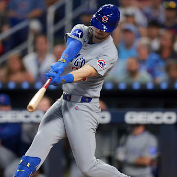 May 20, 2025; Miami, Florida, USA; Chicago Cubs right fielder Kyle Tucker (30) hits a solo home run against the Miami Marlins during the first inning at loanDepot Park. 