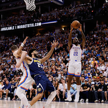 May 11, 2025; Denver, Colorado, USA; Oklahoma City Thunder guard Cason Wallace (22) grabs a rebound as Denver Nuggets guard Jamal Murray (27) is tied up with center Isaiah Hartenstein (55) as forward Aaron Gordon (32) defends in the second quarter during game four of the second round of the 2025 NBA Playoffs at Ball Arena. Mandatory Credit: Isaiah J. Downing-Imagn Images