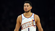 Nov 24, 2025; Phoenix, Arizona, USA; Phoenix Suns guard Devin Booker (1) against the Houston Rockets in the first half at Mortgage Matchup Center. Mandatory Credit: Mark J. Rebilas-Imagn Images