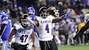 Nov 16, 2024; Provo, Utah, USA; Kansas Jayhawks running back Devin Neal (4) celebrates a touchdown against the Brigham Young Cougars during the first quarter at LaVell Edwards Stadium. Mandatory Credit: Rob Gray-Imagn Images