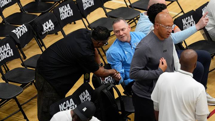 Michael Malone, University of North Carolina basketball head coach, sits in the coaches section during the third day of the 2026 Nike EYBL Peach Jam at Riverview Park Activities Center in North Augusta, S.C., on Thursday, July 16, 2026.