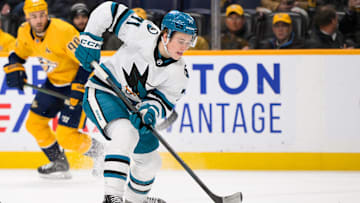Jan 21, 2025; Nashville, Tennessee, USA;   San Jose Sharks center Macklin Celebrini (71) skates with the puck against the Nashville Predators during the second period at Bridgestone Arena. Mandatory Credit: Steve Roberts-Imagn Images