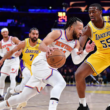 Mar 6, 2025; Los Angeles, California, USA; New York Knicks guard Jalen Brunson (11) moves to the basket against Los Angeles Lakers center Trey Jemison III (55) during the first half at Crypto.com Arena. Mandatory Credit: Gary A. Vasquez-Imagn Images