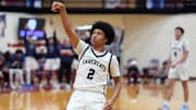 Southmoore's Tyson Pogi watches as he makes a 3-pointer during a high school basketball game between Southmoore and Edmond Santa Fe in Moore, Okla., Friday, Feb. 28, 2025.