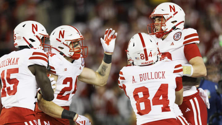 Nov 18, 2023; Madison, Wisconsin, USA;  Nebraska Cornhuskers quarterback Chubba Purdy (12) celebrates after scoring a touchdown during the first quarter against the Wisconsin Badgers at Camp Randall Stadium. Jeff Hanisch-USA TODAY Sports