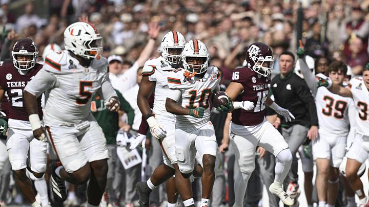 Dec 20, 2025; College Station, TX, USA; Miami Hurricanes wide receiver Malachi Toney (10) returns a punt against the Texas A&M Aggies during first half of the first round game of the CFP National Playoff at Kyle Field. Mandatory Credit: Maria Lysaker-Imagn Images