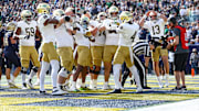 Oct 26, 2024; East Rutherford, New Jersey, USA;  Notre Dame Fighting Irish running back Jeremiyah Love (4) celebrates a rushing a touchdown with teammates during the first half against the Notre Dame Fighting Irish at MetLife Stadium.