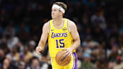 Nov 10, 2025; Charlotte, North Carolina, USA; Los Angeles Lakers guard Austin Reaves (15) brings the ball up the court during the second quarter against the Charlotte Hornets at Spectrum Center. Mandatory Credit: Brian Westerholt-Imagn Images