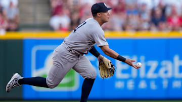 New York Yankees shortstop Anthony Volpe (11) plays a ground ball off the bat of Cincinnati Reds designated hitter Tyler Stephenson (37) in the second inning of the MLB interleague game between the Cincinnati Reds and the New York Yankees at Great American Ball Park in downtown Cincinnati on Monday, June 23, 2025.