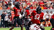 Sep 27, 2025; Raleigh, North Carolina, USA; North Carolina State Wolfpack quarterback CJ Bailey (11) with the ball during the first half of the game against Virginia Tech Hokies at Carter-Finley Stadium. Mandatory Credit: Jaylynn Nash-Imagn Images