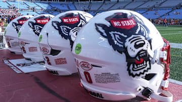 Sep 7, 2024; Charlotte, North Carolina, USA; North Carolina State Wolfpack helmets during pregame activity for the Dukes Mayo Classic against the Tennessee Volunteers at Bank of America Stadium. Mandatory Credit: Jim Dedmon-Imagn Images
