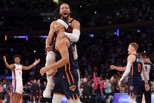 New York Knicks guards Jalen Brunson and Josh Hart celebrate together during an NBA game against the Detroit Pistons.