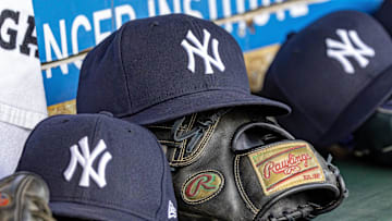 Apr 7, 2025; Detroit, Michigan, USA; New York Yankees baseball hats and gloves in the dugout out in the eighth inning against the Detroit Tigers at Comerica Park. Mandatory Credit: David Reginek-Imagn Images