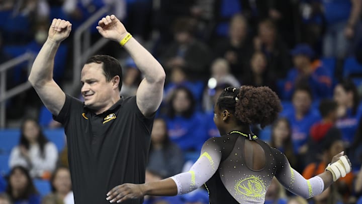 Mar 30, 2023; Los Angeles, CA, USA;  Missouri coach Shannon Welker and Amari Celestine celebrate at the end of her floor exercise routine during the NCAA Women   s Gymnastics Los Angeles Regional at Pauley Pavilion. Mandatory Credit: Robert Hanashiro-Imagn Images