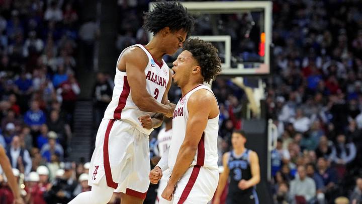 Mar 27, 2025; Newark, NJ, USA; Alabama Crimson Tide guard Latrell Wrightsell Jr. (3) and Alabama Crimson Tide guard Mark Sears (1) celebrate during the second half against the Brigham Young Cougars during an East Regional semifinal of the 2025 NCAA tournament at Prudential Center. Mandatory Credit: Robert Deutsch-Imagn Images