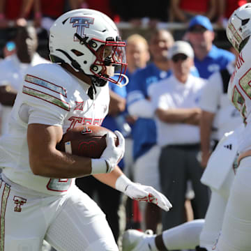 Texas Tech Red Raiders running back Cameron Dickey (8) rushes against the Brigham Young Cougars in the first half at Jones AT&T Stadium.